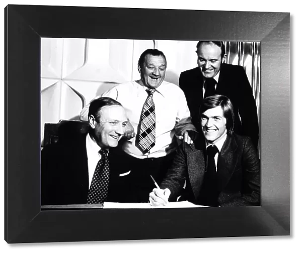 Kenny Dalglish signs for Liverpool for a British record fee of £440