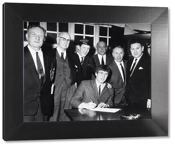 Emlyn Hughes signs for Liverpool FC February 1967 watched by Bill Shankly second