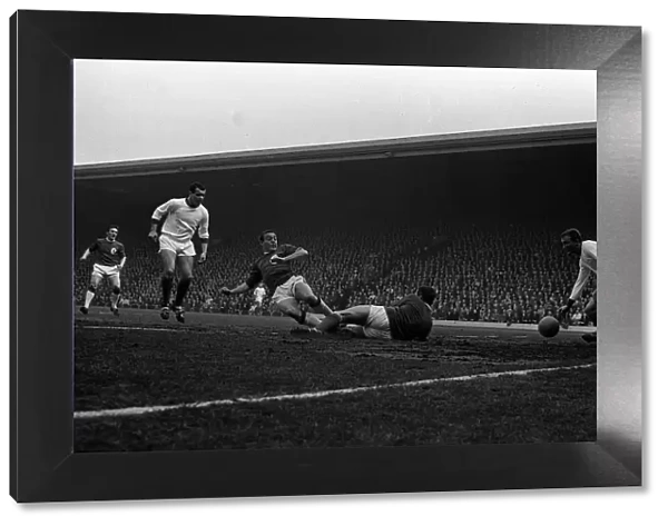 Ian St John of Liverpool scores past keeper Furnell in the game against Arsenal that gave
