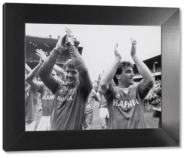 Everton players Neville Southall and Kevin Ratcliffe acknowledge the applause of the fans