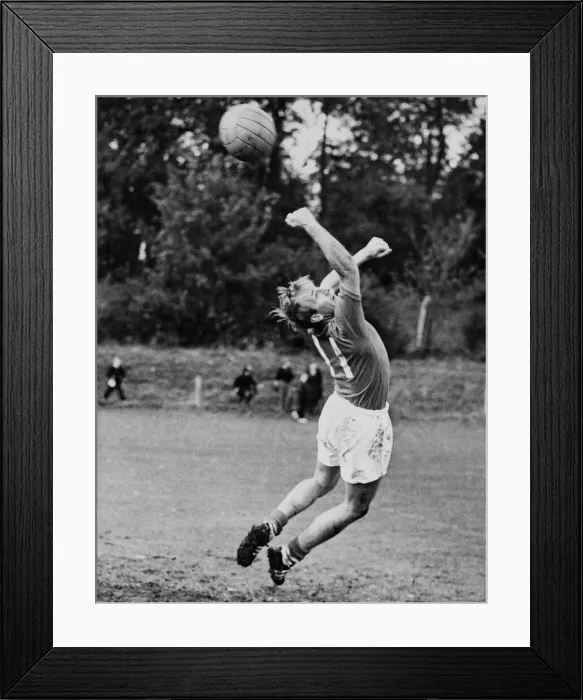 Framed Print : England footballer Bobby Charlton takes a turn in goal during a training session Framed Print : England footballer Bobby Charlton takes a turn in goal during a training session