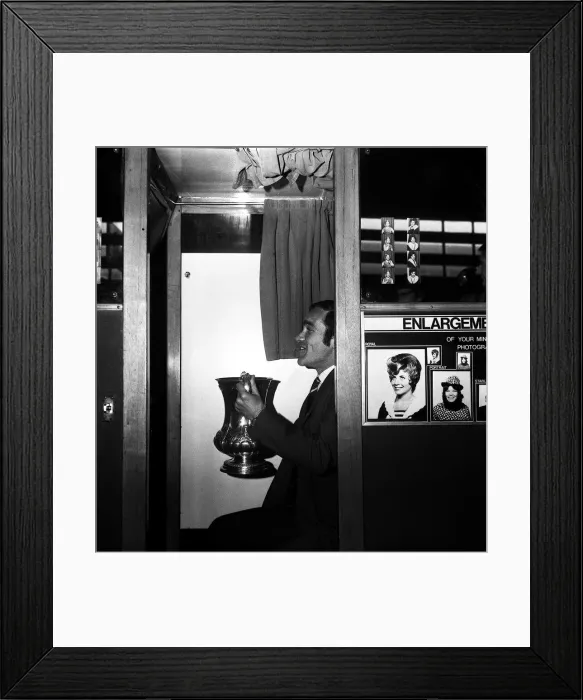 Framed Print : Chelsea captain Ron Harris sits in the Photo booth on Piccadilly station with the FA Cup Framed Print : Chelsea captain Ron Harris sits in the Photo booth on Piccadilly station with the FA Cup