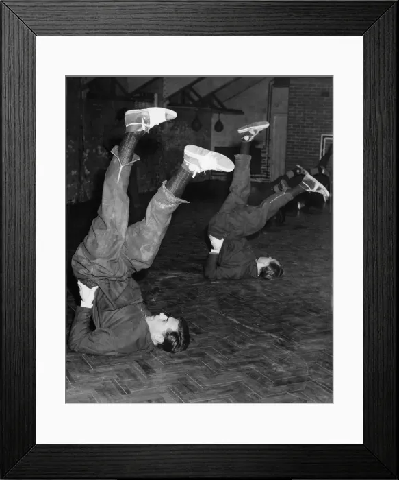 Framed Print : Blackpool FC players George Farm and Tom Garrett go through that old cycling routine as Framed Print : Blackpool FC players George Farm and Tom Garrett go through that old cycling routine as