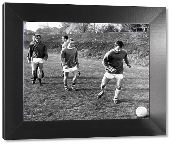 Celtic Striker Bobby Lennox in training, practicing his sprint and shoot