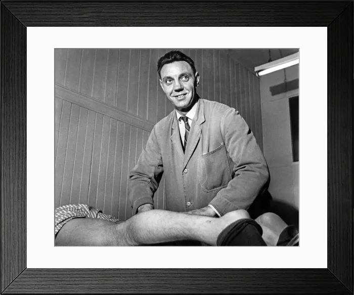 Framed Print : Assistant trainer Joe Fagan massages the legs of Peter Thompson in the medical room Framed Print : Assistant trainer Joe Fagan massages the legs of Peter Thompson in the medical room