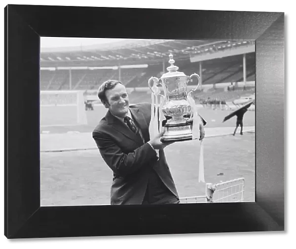 Leeds Manager Don Revie seen here in a deserted Wembley holding the F. A