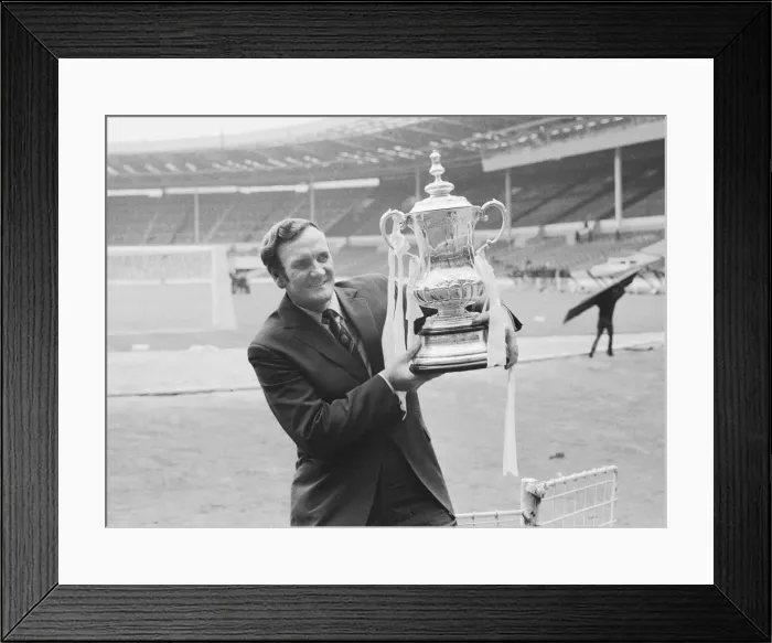 Framed Print : Leeds Manager Don Revie seen here in a deserted Wembley holding the F. A Framed Print : Leeds Manager Don Revie seen here in a deserted Wembley holding the F. A