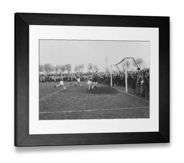 Framed Print : Ronnie Corbett far left assists Tommy Steele to score a goal in theTV All Stars XI vs