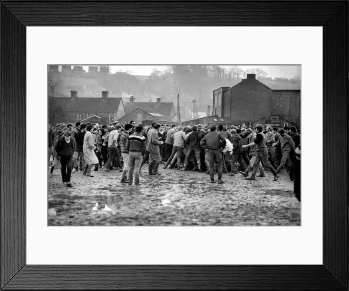 Framed Print : The game has started and somewhere in the middle of that heaving crowd is the ball Framed Print : The game has started and somewhere in the middle of that heaving crowd is the ball