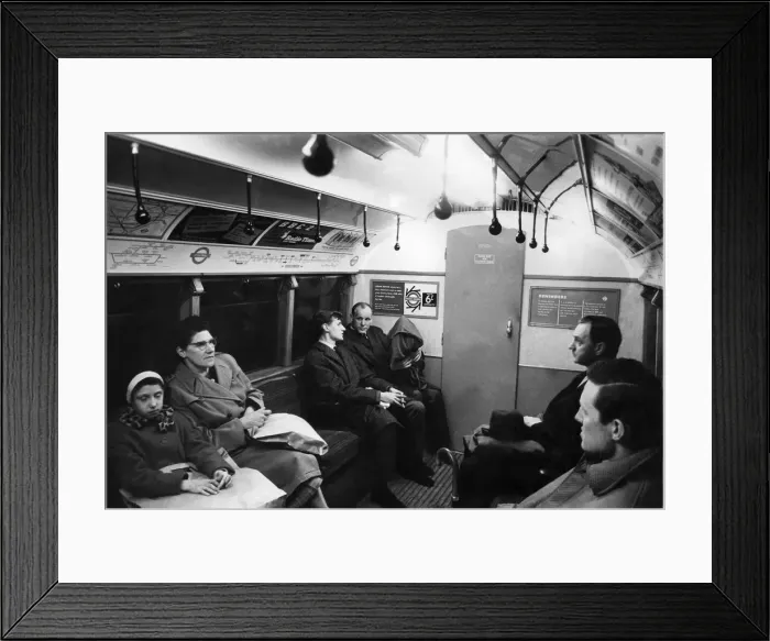 Framed Print : The quiet man holding a parcel on the tube train went unnoticed Framed Print : The quiet man holding a parcel on the tube train went unnoticed
