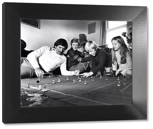 Tommy Smith plays table soccer with his wife Sue, and children Darren (11) and Janette (8