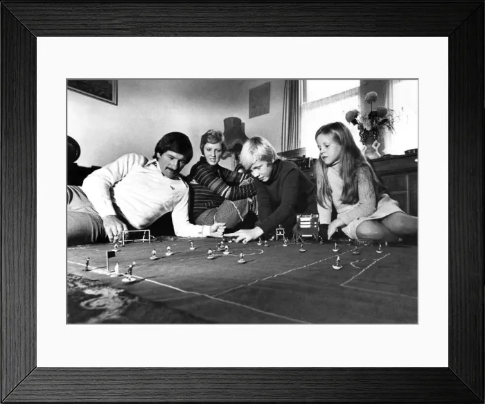 Framed Print : Tommy Smith plays table soccer with his wife Sue, and children Darren (11) and Janette (8 Framed Print : Tommy Smith plays table soccer with his wife Sue, and children Darren (11) and Janette (8