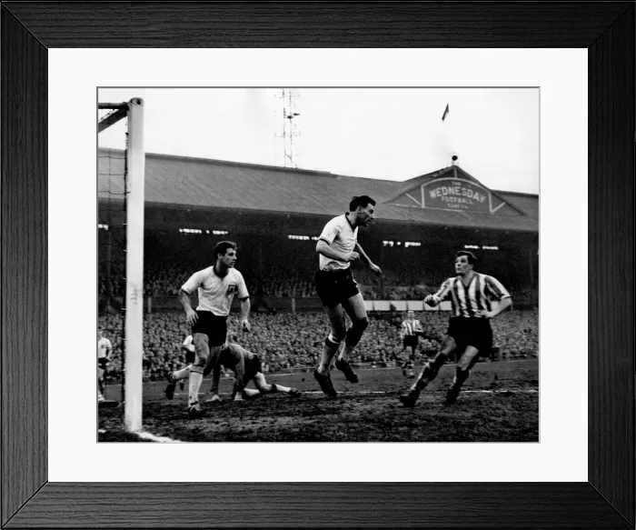 Framed Print : Angus the Burnley right back heads away to relieve a hectic spell of pressure Framed Print : Angus the Burnley right back heads away to relieve a hectic spell of pressure