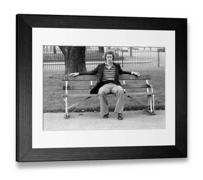 Framed Print : Arsenal footballer Charlie George sitting on a bench at Hackney marshes February Framed Print : Arsenal footballer Charlie George sitting on a bench at Hackney marshes February