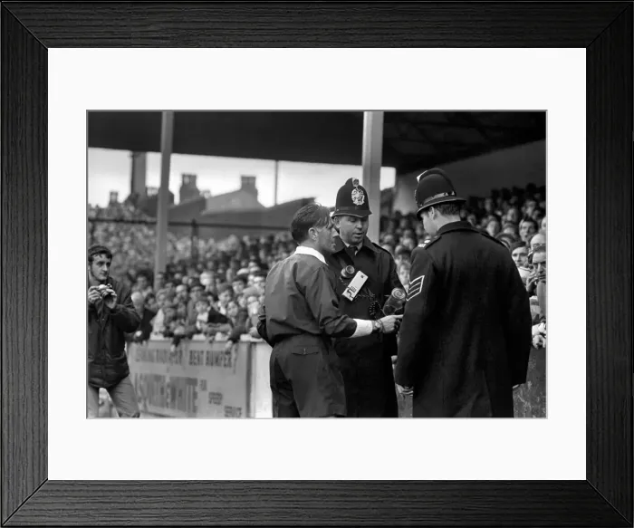 Framed Print : Sport: Football: Leeds v. Derby. The Referee talks to police after the bottle incident Framed Print : Sport: Football: Leeds v. Derby. The Referee talks to police after the bottle incident
