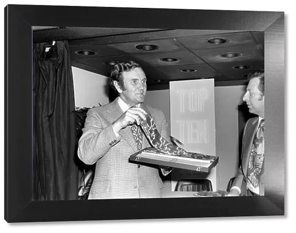 Football manager Don Revie accepts his prize at the Tie Manufacturers Association Top Ten