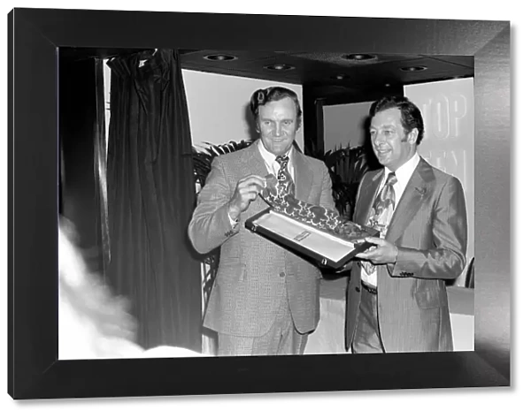 Football manager Don Revie accepts his prize at the Tie Manufacturers Association Top Ten