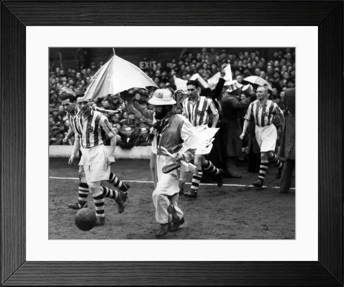 Framed Print : Blackpool v. Colchester. The Colchester team were escorted on to the field by their Framed Print : Blackpool v. Colchester. The Colchester team were escorted on to the field by their