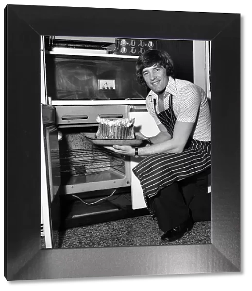Chelsea striker Ian Hutchinson Prepares a meal for some of his team mates at his home in