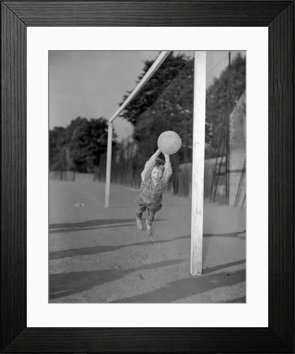 Framed Print : Ten year old George Welch makes a flying save while in goal for his school football team Framed Print : Ten year old George Welch makes a flying save while in goal for his school football team