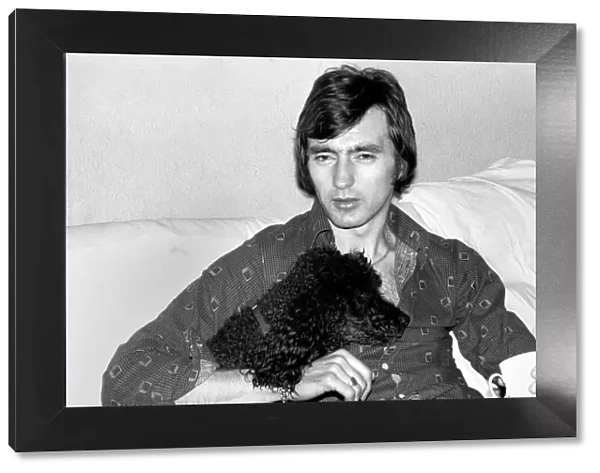 England and Stoke international hero Alan Hudson seen here with his pet poodle