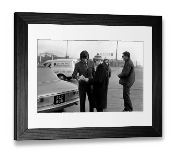 Framed Print : George Best signs autographs and boards the coach at Old Trafford he has just been fined Framed Print : George Best signs autographs and boards the coach at Old Trafford he has just been fined