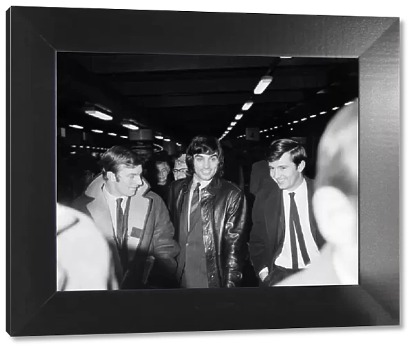 George Best arrives at Euston Station with members of Manchester United Football team for