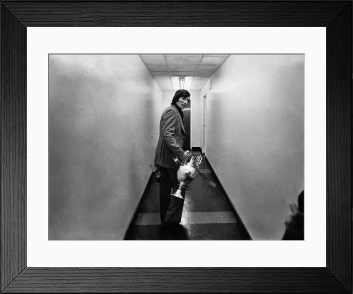 Framed Print : Liverpool v. Leicester Still Clutching the Trophy leaving the dressing room is Captain Framed Print : Liverpool v. Leicester Still Clutching the Trophy leaving the dressing room is Captain