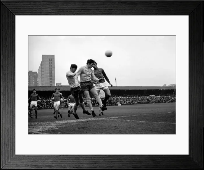 Framed Print : Ipswich attack - Brown heads away a corn are kick. McNeil of Ipswich is in picture