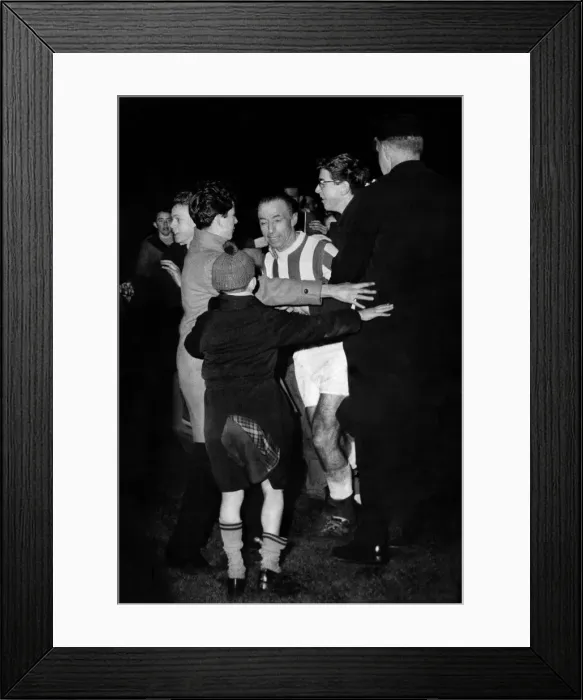 Framed Print : Stanley Matthews is mobbed by fans and supporters at Stoke after the game Framed Print : Stanley Matthews is mobbed by fans and supporters at Stoke after the game