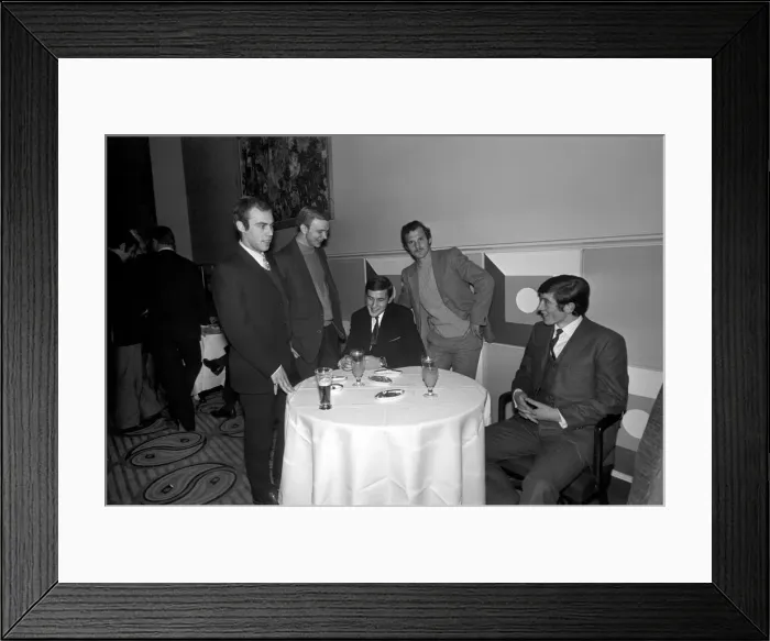 Framed Print : Five members of the Belgians K Lierse football team having a talk over prospects around