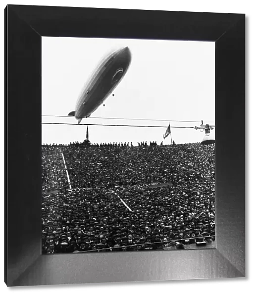 The Graf Zeppelin passing low over Wembley Stadium during the FA Cup Final in which