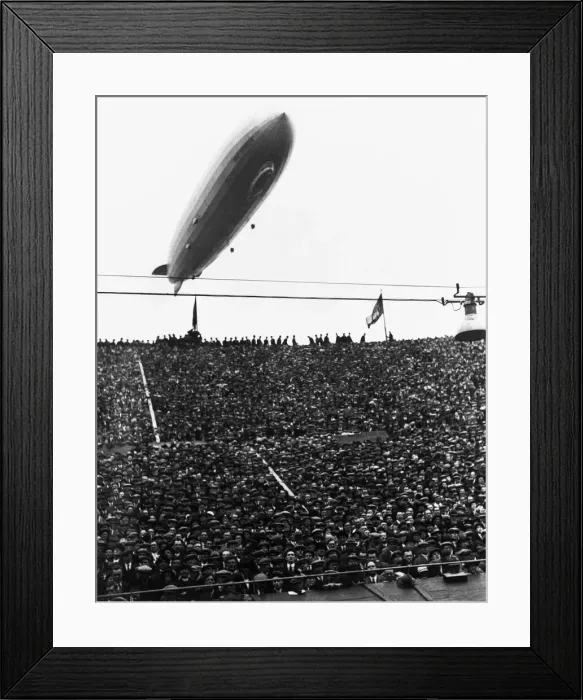 Framed Print : The Graf Zeppelin passing low over Wembley Stadium during the FA Cup Final in which Framed Print : The Graf Zeppelin passing low over Wembley Stadium during the FA Cup Final in which