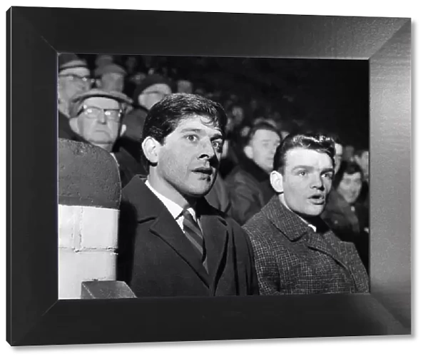 Kevin Keelan the Norwich goalie and Hugh Curran who is injured watching the Stockport v