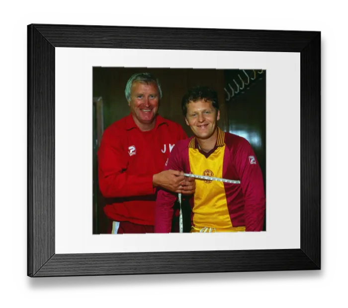 Framed Print : Jock Wallace with measuring tape around Andy Ritchie July 1983
