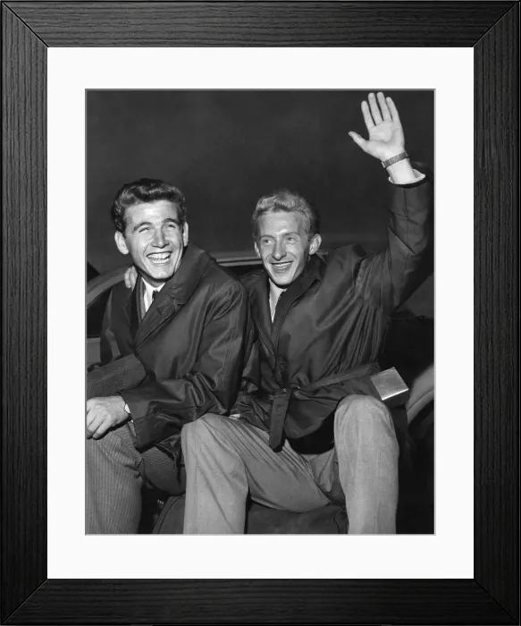 Framed Print : Happy Manchester United players Denis Law and Joe Baker land at Ringway Airport in