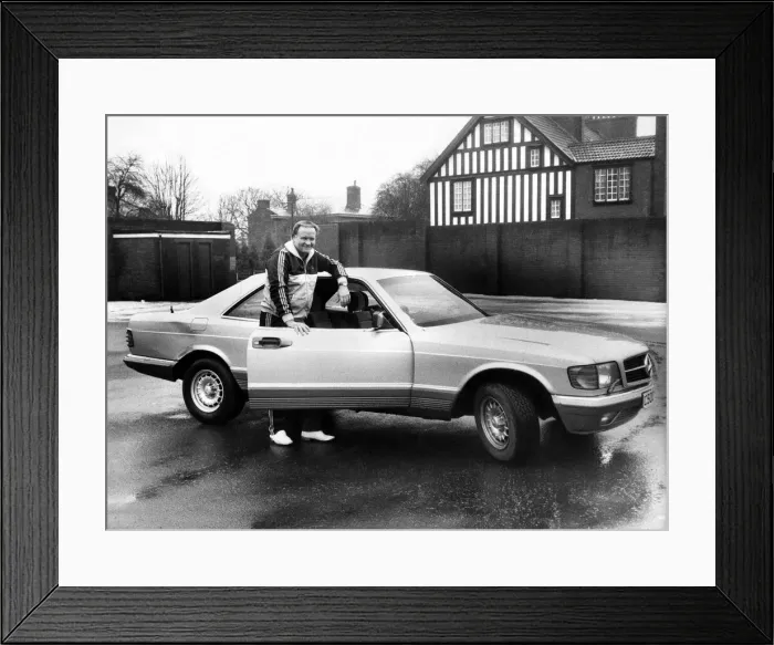 Framed Print : Ron Atkinson. Manchester United manager with his Mercedes car. January 1986 P003655