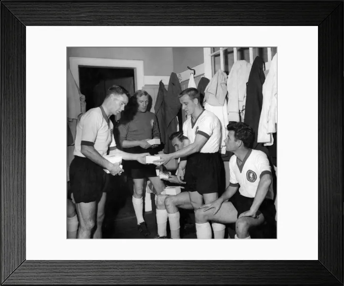 Framed Print : Billy Liddell (left) meets opposition team players in the changing room at Anfield before