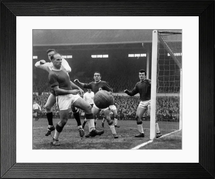 Framed Print : Tough moment for Ronnie Moran the Liverpool left when facing his own goal being tackled Framed Print : Tough moment for Ronnie Moran the Liverpool left when facing his own goal being tackled