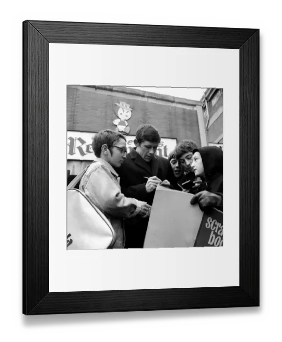 Framed Print : Sheffield Wednesday football player Jackie Sinclair signs autographs for fans at a local Framed Print : Sheffield Wednesday football player Jackie Sinclair signs autographs for fans at a local