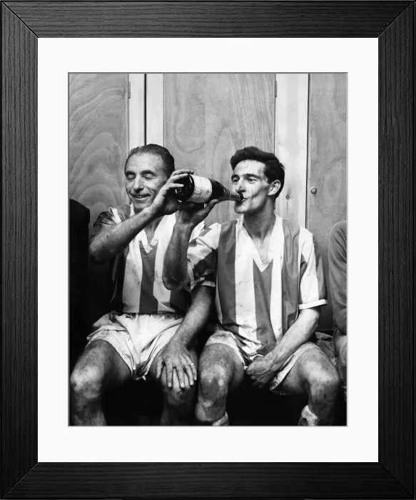 Framed Print : Former Blackpool buddies Stanley Matthews and Jack Mudie relax in the dressing room Framed Print : Former Blackpool buddies Stanley Matthews and Jack Mudie relax in the dressing room