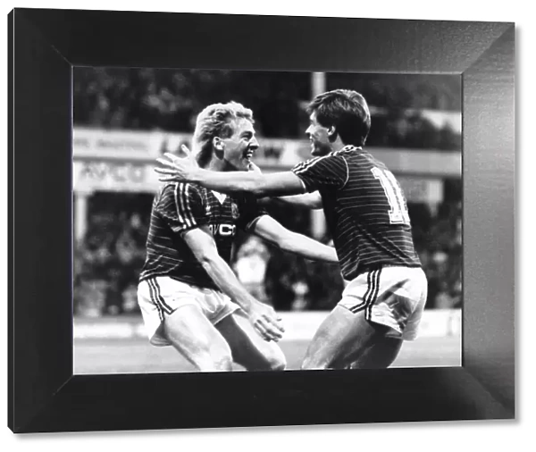 Goal. Frank McAvennie gets congratulations from team-mate Tony Cottee after scoring