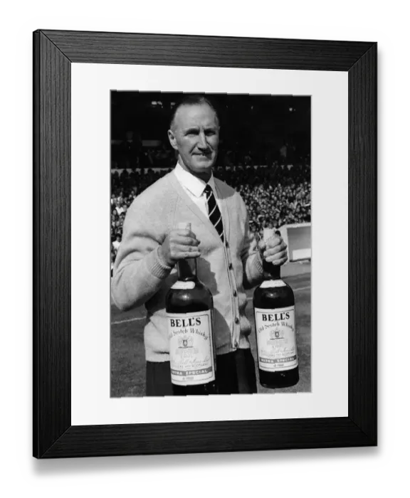 Framed Print : Harris John, Manager Sheffield United FC. holds two giant bottles of Bells whisky