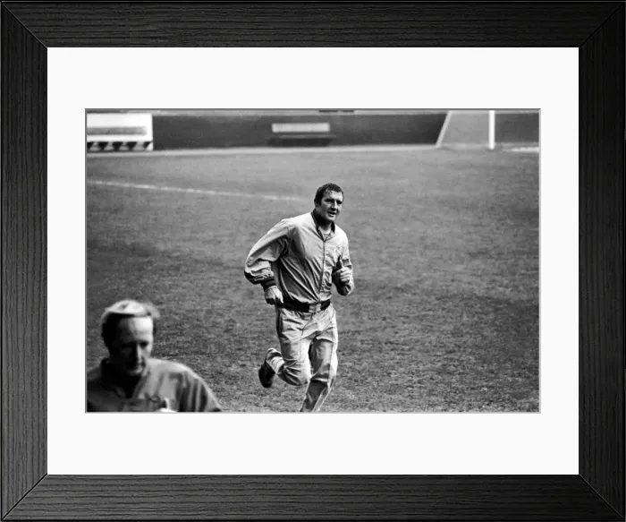 Framed Print : Manchester City training Assistant manager Malcolm Allison sweats it out trying to