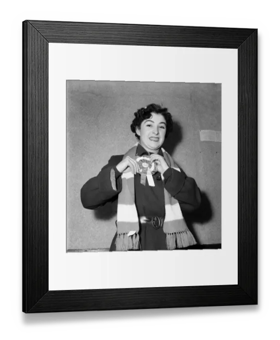 Framed Print : A female Arsenal fan showing of her rosette and scarf. February 1953 D697 Framed Print : A female Arsenal fan showing of her rosette and scarf. February 1953 D697