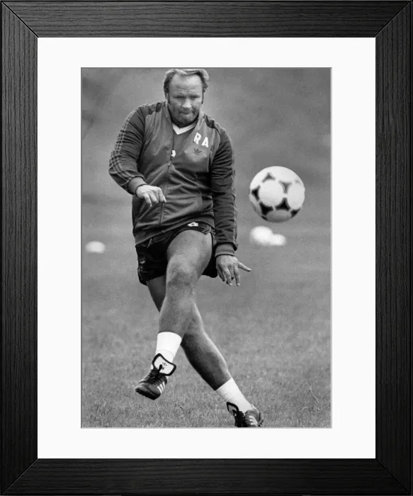Framed Print : Ron Atkinson on the ball with a precision pass during training. August 1984 P017034 Framed Print : Ron Atkinson on the ball with a precision pass during training. August 1984 P017034