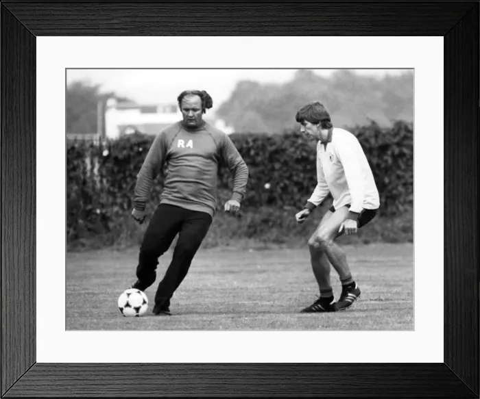 Framed Print : Arnold Muhren keeps a close eye on Manchester United manager Ron Atkinson during a Framed Print : Arnold Muhren keeps a close eye on Manchester United manager Ron Atkinson during a