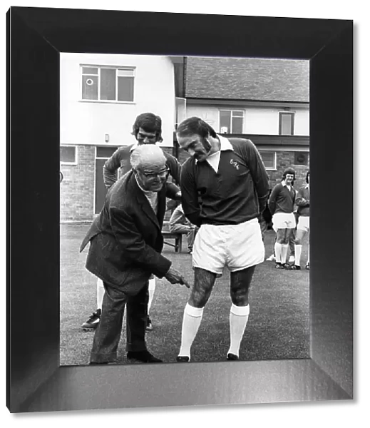 Everton football club chairman Mr John Moores has a feel at the injured knee of John