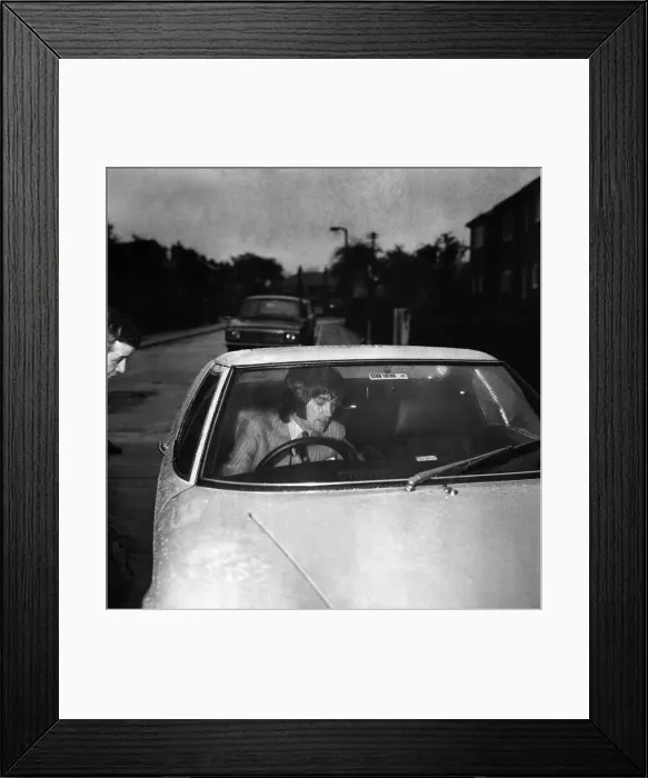 Framed Print : Manchester United star George Best leaving the house to go to the match against Framed Print : Manchester United star George Best leaving the house to go to the match against