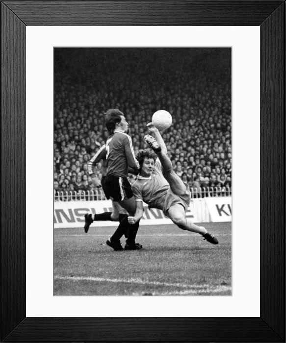 Framed Print : Mancheter City v Bristol. Brian Kidd blasts a shot over Colliers head Framed Print : Mancheter City v Bristol. Brian Kidd blasts a shot over Colliers head